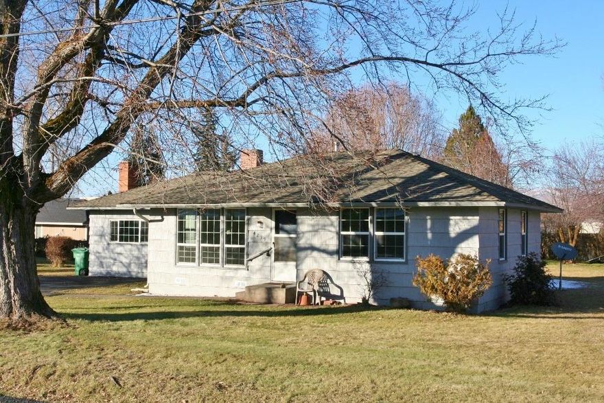 What A Gem! Adorable 1280 SQFT 3-bedroom cottage loaded with charm & in MOVE-IN CONDITION located on .32 acre suburban lot with loads of room for RV parking or garage/shop building! Sparkling clean from top to bottom, boasting all new interior paint, brand new carpet, new gas wall heater, 2 new electric heaters, updated light fixtures, newer exterior paint, architectural roof, hot water heater, electric main service & attractive vinyl windows too. Archways & alcoves, sunny bright kitchen with new range, super laundry room w/ pantry & utility sink, 3rd bedroom is approx 20x20 w/ stone fireplace, closet & outdoor access perfect for a 2nd living space too. Clear pest dry rot & whole house inspection on file. This one is a keeper, so call today!