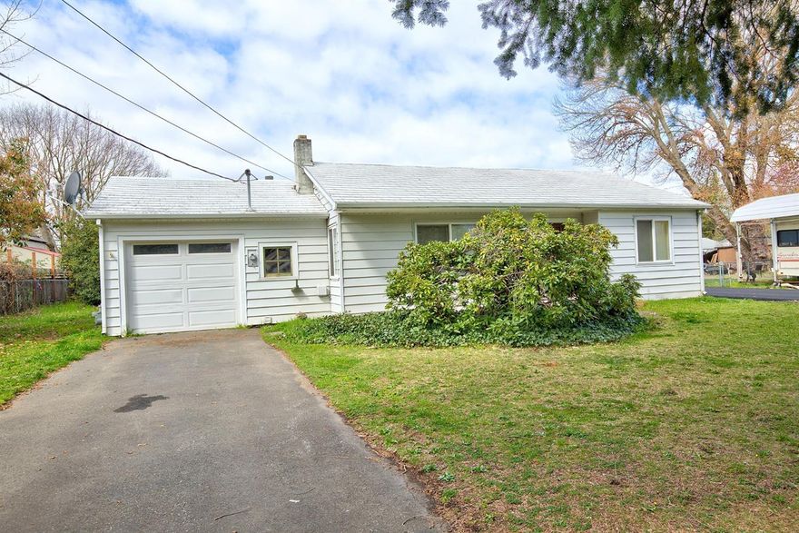 Charming cottage style home on nice lot, original hardwood floors, built-ins, vinyl windows, nice size living room opening into dining room and kitchen. Attached one car garage and detached shop along with new fencing (in process of being put in )complete this sweet package - don't wait too long or you will miss your chance!