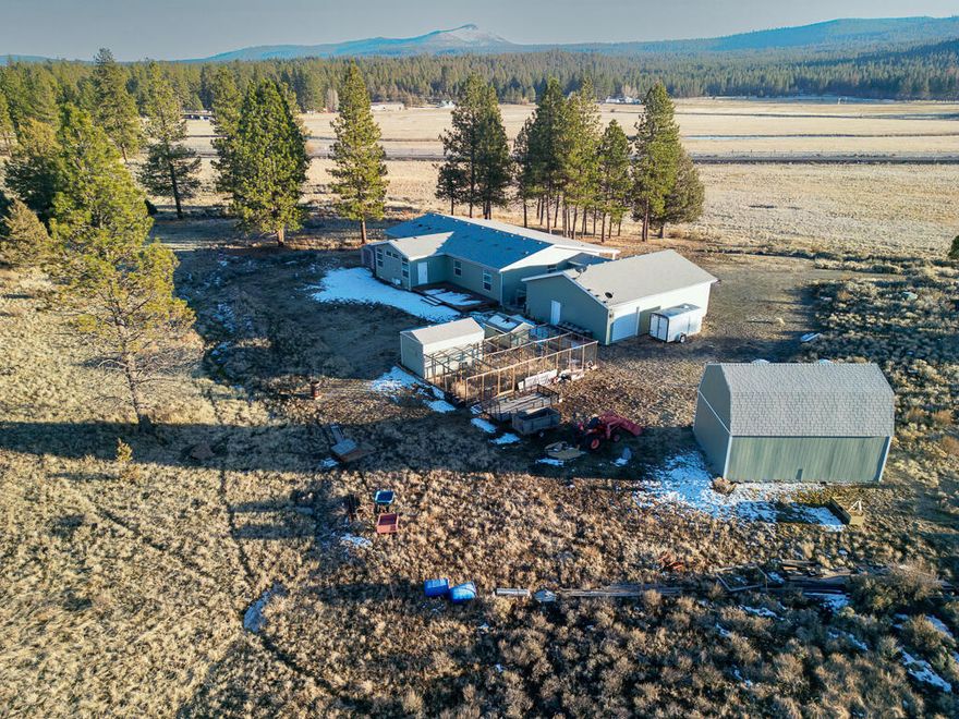 Escape the hustle and discover your own 22.74-acre retreat in scenic Beatty, Oregon! This 3-bed, 3-bath custom home features 9' ceilings, granite counters, maple cabinetry, and a stunning great room with built-in bookcases. The spacious primary suite includes a sitting area, and the office offers built-ins and ample workspace. Enjoy peaceful views of deer, antelope, wild horses, and birds from the covered front porch. Includes a 3-car garage, 16x24 Tuff Shed with lofts, chicken coop, and dog kennel. Approx. 16 acres of partially fenced pasture are ready for your animals, hobbies, or garden. Central A/C and a 50-year roof (2020) offer comfort and durability. Whether you're relocating for space, self-sufficiency, or tranquility, this Klamath County gem offers freedom to live, work, and play your way. Motivated seller—bring offers!