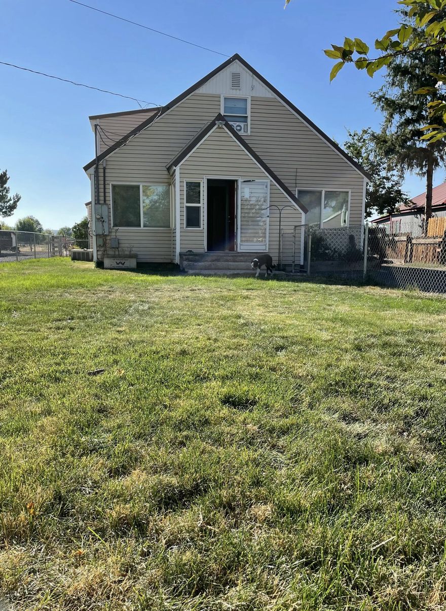 Charming 3 bed, 2 bath home on good sized lot close to schools and hospital. Many updates in the home including tile in the bathrooms, new fixtures and updated wiring. Two bedrooms and full bath on main level with master suite upstairs. There is a separate laundry room and a large sunroom of the back of the house that leads to a nice deck and good sized work shop. Front yard is fenced with mature trees.