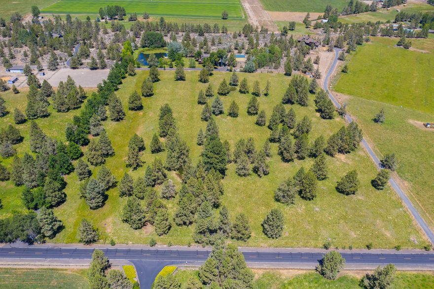 Tree lined drive leads to peaceful park-like setting of this lovely home, perfectly situated to capture the impressive mountain views.  Enjoy the views while relaxing in the shade of the pond side gazebo.  Lovingly created w/ friends & family in mind w/ plenty of indoor & outdoor areas for play & entertaining.  Big mountain views from great room that flows into dining area, kitchen & outdoors to spacious deck, perfect for summer BBQ's & evening stargazing.  Master bedroom & office are ideally located for privacy & to capture the glistening pond & striking mountain views. 4 other bedrooms are situated to provide a peaceful get-away for family & guests.  One of the highlights of this special property is the family room w/ full wet bar & billiard area that leads to the spacious yard, 2 gazebos & the bass & lily pad pond.  Fully fenced 19.70 acres can accommodate pets of all sizes & shop provides a multitude of uses.  Centrally located & just a few minutes drive to esteemed Cascade Academy