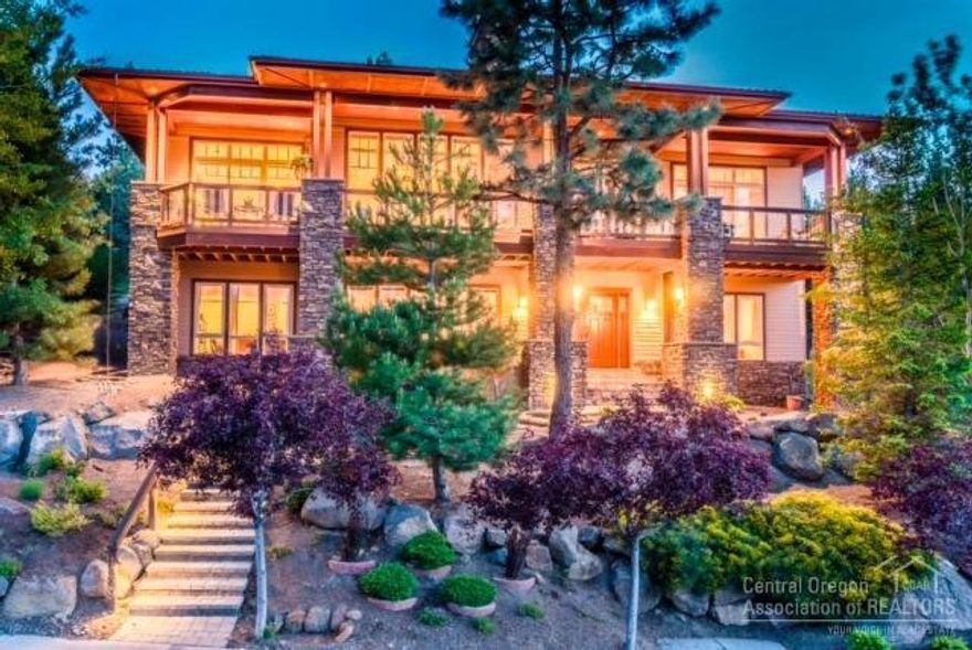 Exceptional quality and tons of upgrades throughout this gorgeous home. A large deck w/ both mountain and city views, a dream kitchen open to the great room w/ soaring stone fireplace. Two dining areas and a wine bar makes this an entertainers delight. Master on main w/ extensive built-ins, & office w/ custom cabinets & shelving. Downstairs features a family room w/ 2 sided fireplace, 2 bdrm suites, w/ beautiful tiled showers, loads of storage & shop area. Water feature, 3 car garage, low maintenance yard.