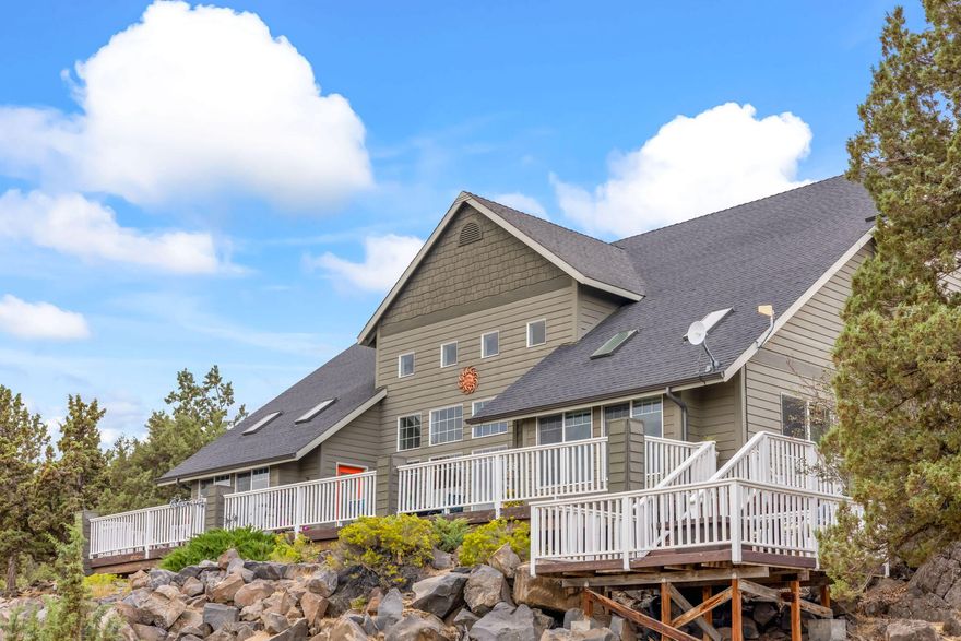 Expansive Estate Home on 5 beautifully unique acres with incredible rock outcroppings & sweeping views of the Valley, Ochoco Mountains, & City Lights. This stunning home offers space, elegance & flexibility; just a short drive to Prineville or Redmond. Inside, you're greeted by grand two-story ceilings & floor-to-ceiling
windows that flood the living space w/natural light. The spacious main-level primary suite provides a peaceful retreat with scenic views. A large office on the main floor
could easily serve as a 5th bedroom or hobby room; ideal for multi-generational living. Upstairs, you'll find three additional bedrooms, along
with a loft area. Step outside to the expansive multi-level deck: ideal for relaxing, entertaining, or soaking in the Central Oregon sunsets. The deck is hot tub-ready
w/hookups. Room to build a shop & a private yet accessible location, this property is a rare find.  Looking for a peaceful getaway or a home close to town w/room to grow, this has it all.