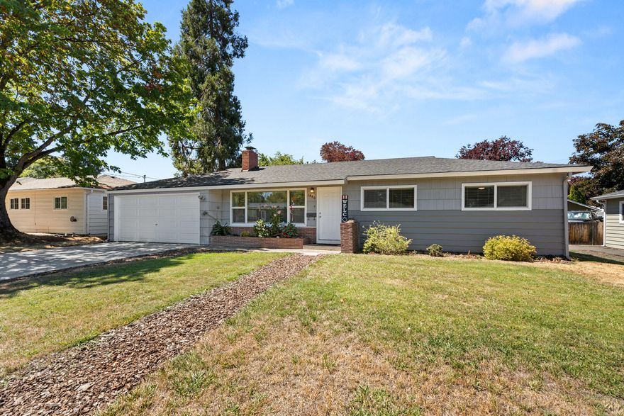 Located in a highly sought-after SW Medford neighborhood, you're sure to be impressed with all this home has to offer. This warm and inviting 3 bedroom, 1.5 bath home has been thoughtfully updated throughout, including a new kitchen and appliances, flooring and carpet, along with electrical and insulation upgrades, top of line garage opener, and a fully repainted exterior, just to name a few. Inside features a great layout with a spacious living room and an extra-large family room, offering plenty of room to spread out. Come outside and you'll find lots of space to relax or entertain under the covered patio. The huge backyard is perfect for outdoor living, gardening and more. Just minutes from shopping, dining, and grocery stores, this well-maintained, move-in ready home combines the peace of a quiet neighborhood with the convenience of nearby amenities.