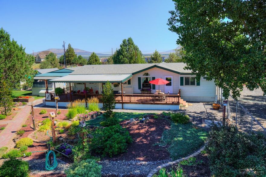 Mtn View property - bring your RV & horses! Located on the edge of CRR w/easy access to shopping & Hwy 97. Updated throughout, laminate, tiled surfaces & shower. Open layout, spacious kitchen w/dbl ovens, bar cabinet & tons of storage. Lg bedrooms w/Master separation. Great outdoor living w/covered deck w/fans. Dbl detached garage w/workbench, storage buildings, greenhouse, wrap around deck, drive thru RV cover & full RV hookups. Fenced horse property w/corral. Hot tub, appliances & furnishings negotiable!