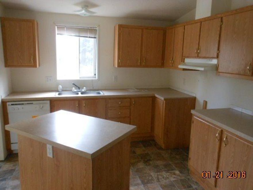 Newer doublewide with full covered front porch. Nice level land that will accommodate gardens and animals. Large shop building with bath. Home has new carpet and vinyl new well pump and holding tank -move in ready.