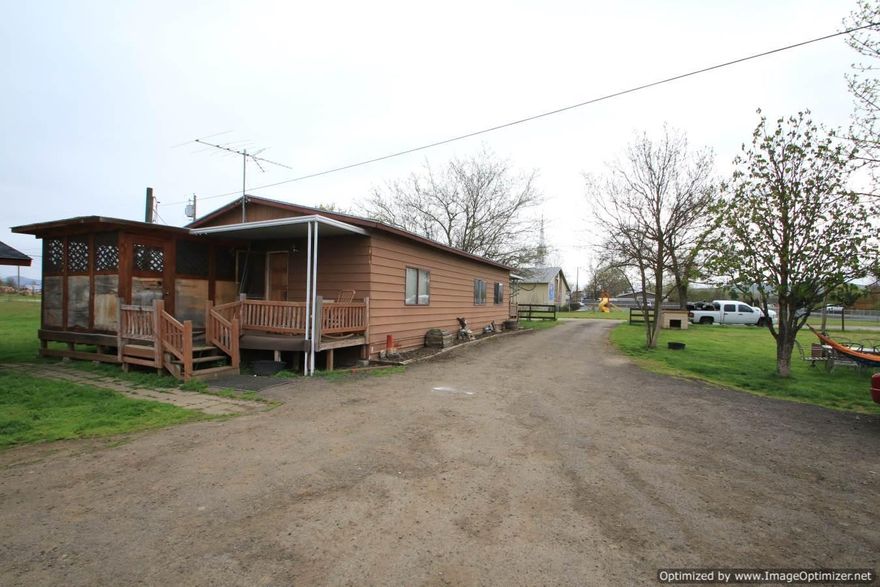 2 flat usable acres fully fenced with shop. Country feel yet city close, with good well, Irrigation from Rogue River Irrigation District and city sewer.