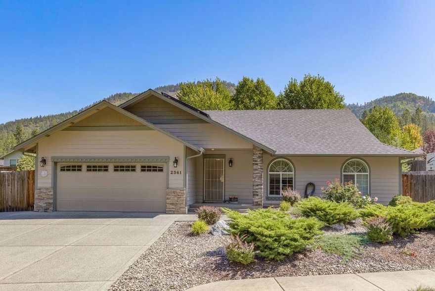 Beautiful, well maintained, custom home in Grace Garden Estates. This home has an excellent floor plan & many custom features, Hickory hardwood floors & cabinets, large walk-in pantry, granite counters with newer appliances & pull out drawers. Two car garage attached, with separate 3rd car garage/shop, (approx 15 ft X 20 ft) in the backyard. Large, paved RV parking area, (approx 14 X 50 ft long) with full hookups. Large master suite with 2 separate closets. Certified Earth Advantage Platinum for maximum energy savings. Solar hot water system. Half bath off of the garage. Other features include: double ovens, solid core doors, built-in vacuum system, gas fireplace, ceiling fans. Very nice covered patio area in the backyard. This home also has a fantastic location next to walking paths and open space.