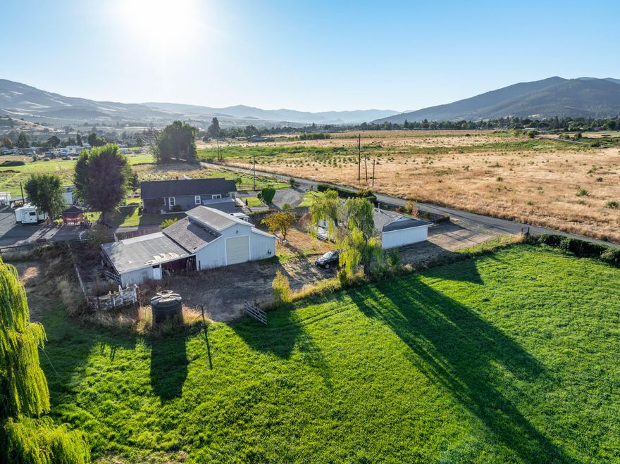 Almost 6 acres of usable land with water rights in Phoenix! This property is loaded with potential and features a large shop—perfect for projects, storage, equipment, or a home-based business—along with an attached garage for everyday convenience. The home is clean, well-maintained, and provides a comfortable place to live while you take advantage of all the land has to offer. With water rights in place, the acreage is ideal for animals, gardening, orchards, or creating your own hobby farm. The property also offers the possibility of adding a pond, giving you even more flexibility to shape it to your vision. Enjoy the best of both worlds with plenty of space, privacy, and room to grow, while still being just minutes to town, schools, shopping, and I-5 access. A rare opportunity in a convenient Southern Oregon location!