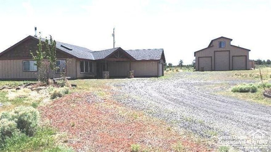 Wow! Price reduced $100,000. 3 bdrms plus a den w/2 baths, 1707 sf. Home was extensively updated w/concrete countertops, new custom cabinets, hardwood flrs, stainless steel appls, wainscoting, new light fixtures. Great rm has vaulted ceilings & wdstv. 2 skylights. 2 stamped concrete patios. 36x48 shop w/2-14 ft & 2-10 ft doors w/pull through entrance/exit. There is also a bdrm & bath in the shop. Lrg covered entry, dbl attached grg. Mountain views. Hay strg, 2 stall barn & corral. Only 10 minutes to Costco!