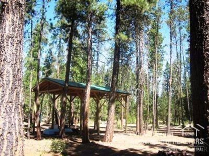 Ready for your own piece of Heaven? This is a very nice, level and clean 1.45 acres with RV cover in place, past septic approval and in area of excellent wells. Tall Ponderosa Pines, deeded co-ownership in Deschutes River frontage, trails to enjoy, and just 3 blocks from vast national forest lands. This is an absolutely pristine building site for your new home. Little River Ranch is a wonderful neighborhood and close to all of Central Oregon's recreation choices!
