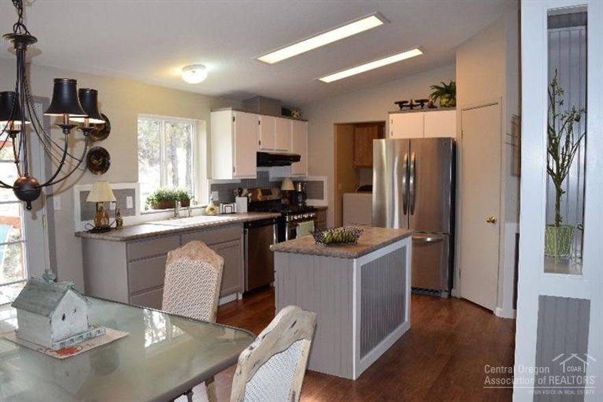 Million Dollar View of Prineville, Mountains and Foothills. Spacious 3 bedroom, 2 bath, with Den/Office, tastefully remodeled kitchen, high-end stainless steel appliances, new paint inside and out, new laminate flooring, vaulted ceiling, simply stunning. Brand new Carrier Furnace & heat pump. Deluxe Gas Stove (propane). Enjoy the Views from covered deck. Storage building. Home was built by Golden West with rounded interior corners.