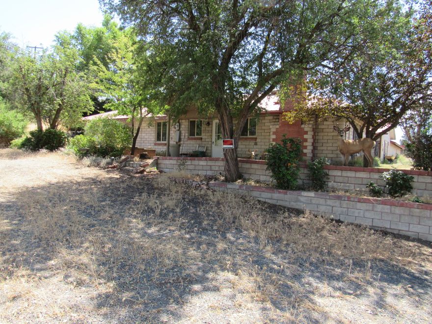 2.48 +/- acres of C1 zoned property that sit next to the Culver Hwy in Madras. A solid old home built in 1949, along with an attached workshop/storage building currently sits on the property. The home will need some work, but could possibly be used as a rental while planning a future use for the well positioned property.