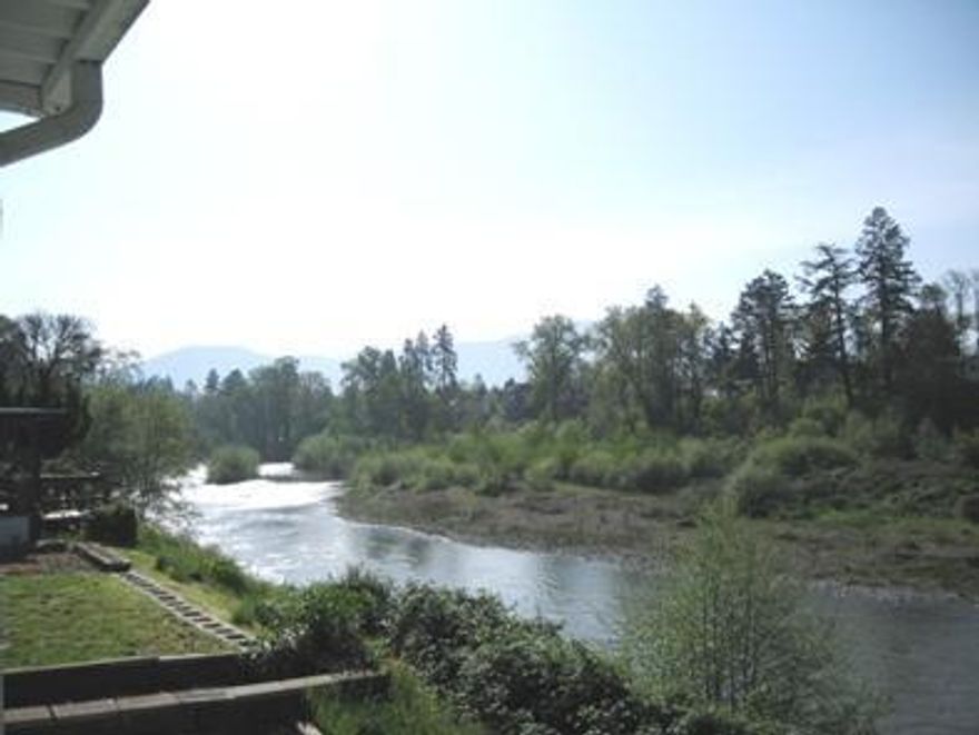 The most incredible views from any home on the RougeRiver. Nestled between a private lake and the RougeRiver, you will enjoy the river from your wrap-around large back and side decks and from most windows in the home. There are no neighbors on one side, just a park setting to the West. Built in 1974, 2bd/2ba, 1176 sq ft with large, bright, cheerful kitchen & a formal dining room w/built-in cabinets. Includes: Electric forced air heat&A/C, One year home warranty, refrigerator, washer/dryer, dishwasher, garbage disposal & 4 ceiling fans.. Owner may carry 1st loan. Quick close.