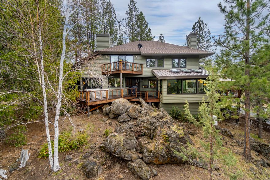 Enjoy country living on 2.35acres w/direct access to Nat'l Forest in desirable Woodside Ranch w/architectural design mid-century styling.Newly updated 4BD,3.5BA,3540 sqft w/att'd 2 car garage.Additional 660 sqft detached guest house w/attached garage.Step into a dramatic living area w/high ceilings & stone fireplace.Wide plank European oak flooring thru-out downstairs.Dual master/guest suit, formal dining, sunroom w/motorized skylights, office att'd to master.Remodeled kitchen includes granite countertops, soft close cabinet drawers/doors, stainless appliances (GE Monogram 36'' built-in refrig/wine fridge, separate freezer, Thermador commercial gas cooktop, oven/micro/warming/drawer, Bosch dishwasher, compactor.)Lg master BA w/dual vanity, shower & soaking tub. New Marvin fiberglass triple glazed windows and doors throughout.  Central vac, 2 wood burning fireplaces with propane start, wet bar.  , 400+ sq ft heated shop/gym, attached horse stalls w/water-electric. Bring all your toys!