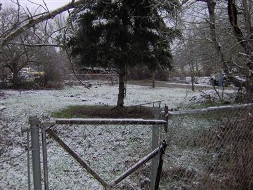 2/3 of an acre in prime country living. There is an existing dwelling that is not livable. The septic is non functioning. The property needs clean up of cars, etc.