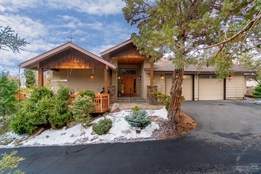 Private Eagle Crest retreat features single level living with great room floor plan, vaulted cedar ceilings, timeless stone fireplace surround, and hardwood floors. New updated kitchen with slab quartz countertops, and tons of cabinetry for storage. Finished bonus space not included in square footage is equipped with mini-kitchen, loft bunk and separate entrance. Expansive deck with new hot tub and private back patio. Large dry storage area with plywood floor plus finished space can be used as extra work space or man cave. Newer blinds and HVAC.