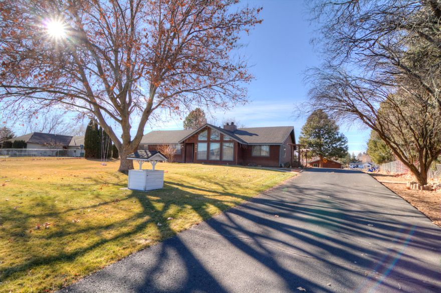 Immaculate property in the Henley School District! This 3 bedroom, 2 bathroom classic, sits on 1.36 acres with a 2 car attached garage, open concept floor plan, fully remodeled master bathroom, new hardwoods and carpet, new paint, newer roof and offers tons of storage.  The property also boasts a detached 24x24 insulated and heated shop, fruit tree orchard, mature trees & beautiful landscaping.