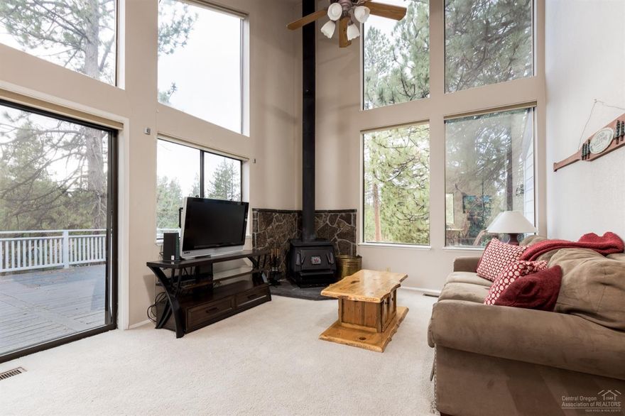 Enjoy the walls of windows from the great room as you enjoy this location in the sought-after River Village Subdivision of Sunriver. Easy access to the bike path which meanders along the river through the Ponderosa Pines. Three bedrooms and two baths nestled in the trees. Wood wall accents to give it that cabin feel. Circular driveway on this acre corner lots allows for plenty of parking. Ready for you to add your own personal touch! Furnished.