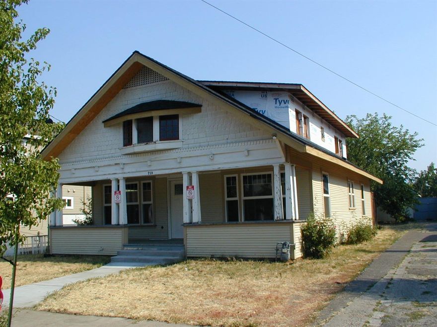 Sellers have taken care of most all the grunt and preparation work needed to restore and revive this fine old house. House was taken and is still down to the studs. (It's now a blank canvas ready to be painted). Improvements since purchase include: New cement walkway and steps, New BCI joists added for additional support to attic conversion second floor to make code compliant, New wiring, breaker box, light system, windows, plumbing, winged roof to give more height in upstairs area which would allow for one more bedroom plus sitting area and full bath, new roofing, siding and fencing across back of lot. There is an approx. 569 sq ft shop at back of property that could convert to single car garage.