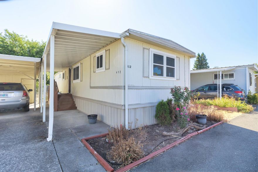 Move in ready! Light and bright well maintained home in 55+ community. Open concept living area.  Newer vinyl windows and mini split for energy efficiency. Membrane roof approx. 10 yrs old. Covered parking space, shed and raised planter beds. Park amenities include RV parking and River access. Come check this cutie out!