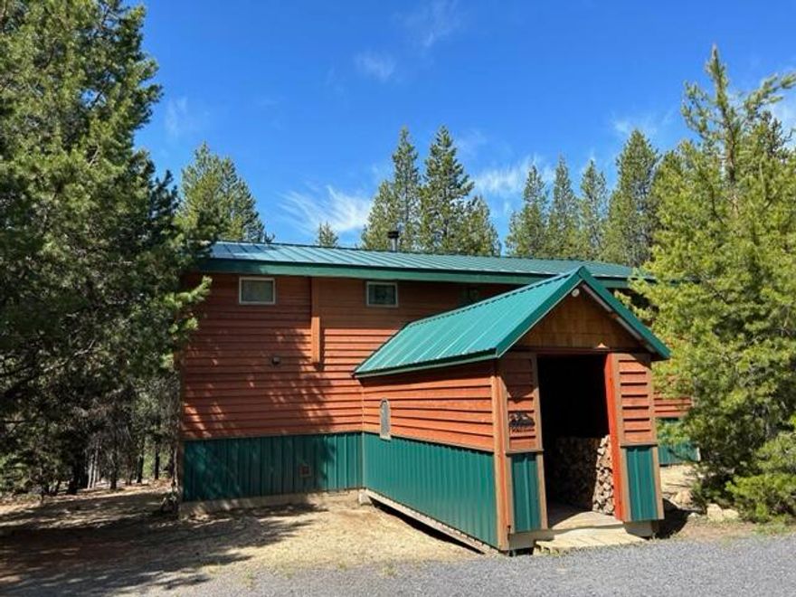 Pride of ownership shows in this immaculate 4 bedroom home nestled in the trees that allow for total privacy. Split level home with kitchen and dining on the first floor, Open Great room on the second floor with wood stove that warms the whole house. loft area overlooks the great room below and has 4 bedrooms and half bath that is plumbed for a tub or shower, buyers discretion. New metal roofing in 2015 and new siding in 2022. This house is a must see to appreciate. Home has been built with summer and winter time use in mind.  Enjoy those warm summer nights relaxing on your deck that is surrounded by trees. Resembles a tree house allowing for views of the property. Access to many winter activities'.  Quad or Snowmobile from your property to forestland. Odell, Crescent Lakes, Willamette Pass Ski Resort within approx. 7 miles.  Many unique features allowing for easy shut down and start up. Double car garage with concrete flooring and shelving for storage on the walls.