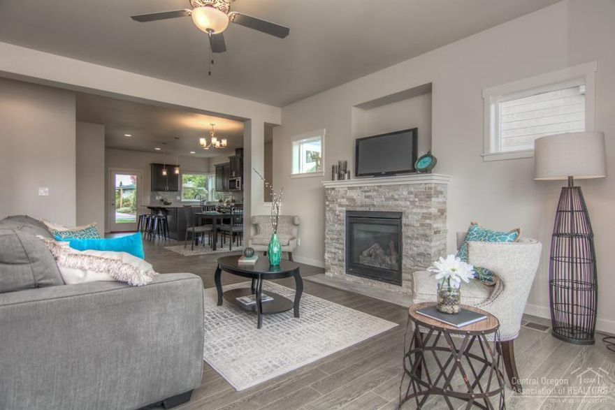 AllyBrooke Custom Homes brings their outstanding product to Canyon Rim Village! THis 3 Bed 2 Bath sgl level home features contemporary craftsman interior selections and ramp for easy access! Across from West Canyon Rim Park & Dry Canyon access. Features incl inviting Entry, solid surface Kitchen island, ss appls, split vanities in the Master Bath w stunning tile shower, walk-in closet, and covered frt & back porches. Landscaped frt & back & fenced. Redmond's custom craftsman neighborhood!Taxes on land only.