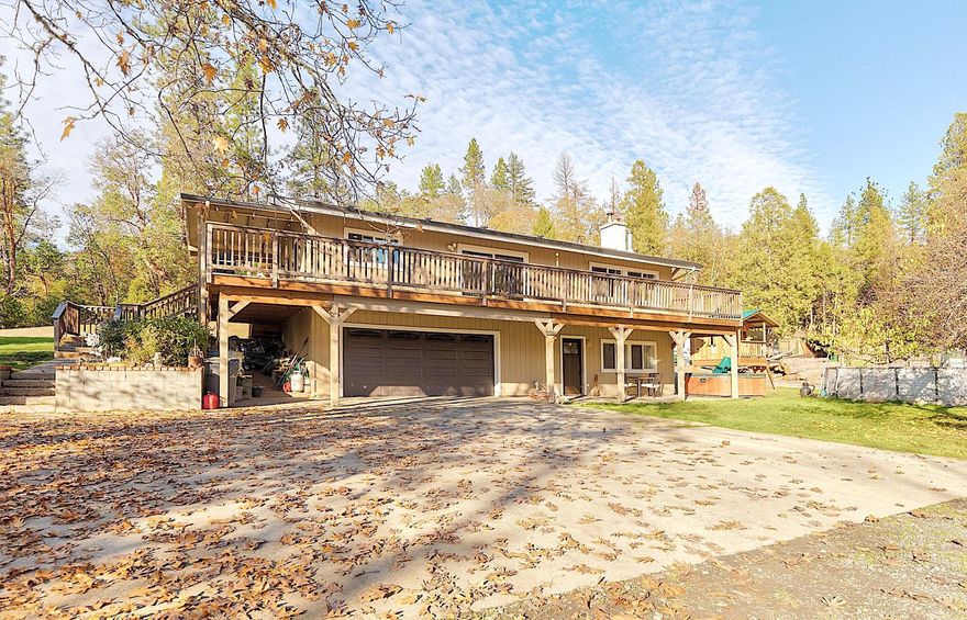 Welcome to 315 Hitching Post Road, a dream mini-farm for horse and animal lovers! Set on over 5 gated acres, this property is fenced and cross-fenced with a 6-stall barn, 60'×100' arena, grazing pasture, hiking/riding trails, chicken coop, fenced garden, woodshed, and detached garage. It's also Firewise certified for peace of mind. The charming, updated home features 3 bedrooms, 2 baths, an office, a cozy living room with fireplace, and a bright, functional kitchen on the main floor. Downstairs offers a spacious bonus room with wood stove. Recent upgrades include the roof and HVAC (approx. 8 years old) plus new windows, doors, and flooring throughout. This property has it all — come see it!