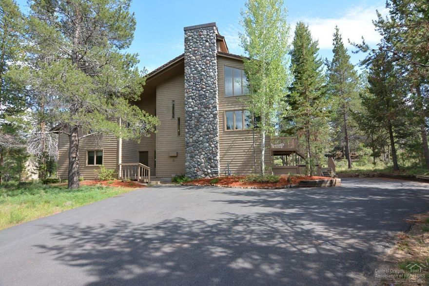 Private location backing up to Fort Rock Park. Enjoy the tranquility of owning .46 acres in Sunriver surrounded by plenty of common area. Open living area with vaulted ceilings, floor to ceiling rock fireplace & large picture windows make this home light and bright. Updated kitchen w/ granite slab counters, island w/ breakfast counter that seats 6, newer stainless appliances. 3 levels of living give your family room to spread out with 5 updated bedrooms, 3 bathrooms +loft, comfortably sleep 14. This home has a new Lennox heating and cooling system, large deck w/ new hot tub.