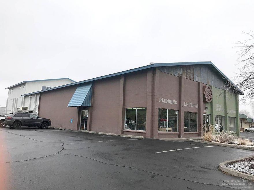 Tremendous opportunity to own two centrally located buildings in the Opportunity Zone in the newly designated Mixed Employment zoning. Main building is comprised of 7,000 sf of retail space on main floor with an additional 2,000 sf of air conditioned office/storage space on the second level. The second building features 5,000 SF of warehouse space with a 10 ft roll up door. Also includes a fenced yard between the buildings for additional outdoor storage space.