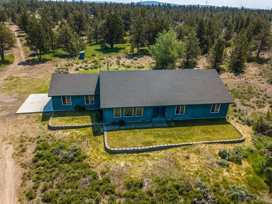 Single story 1,920 sf, 3 bedroom, 2 bath home with Cascade Mountain and farm views located in a secluded section of the 44.79 acre property. Vaulted kitchen with solid raised panel red oak cabinets and laminate counters. Vaulted living room with mountain and farm views. Log accents in living room and dining room. Wood stove off dining area. Both bathrooms with solid raised panel red oak cabinets, laminate counters and tile flooring. Master bedroom with walk-in closet. Separate laundry room. 2 car attached garage. Lots of extra parking areas and plenty of room to build a detached barn/garage/shop.&nbsp;Out of area owner has stated that the property is being sold in as is'' condition and the seller will not make any repairs.