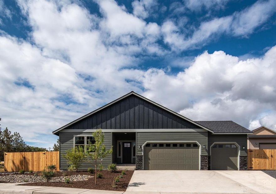 Move in Ready! Affordable luxury built by Dunlap Fine Homes on the Bend side of Redmond. Spacious living both inside & out, w/plenty of room for entertaining. Vaulted Great Room plan w/open Kitchen & massive central island. Tons of cabinetry & prep space on the slab Quartz counters. Neat & tidy full height tiled back splash, SS appliances & farm sink. Living space offers a cozy corner Gas burning fireplace w/stylish accents & room for gathering. Desirable Master separation, walk in closet, step in shower & dual vanities. 2 additional guest rooms off the entry, Laundry room w/storage & folding table too! Durable wood look laminate flooring, carpet in the bedrooms & luxury vinyl plank in baths, 2 white blinds. Gas forced air, A/C & a custom pergola over the back patio for yr round comfort. Triple car garage, gated RV parking, fully fenced, landscaped w/auto sprinklers. There's still space in the back yard for a tiny home, ADU, workshop or? Call a R