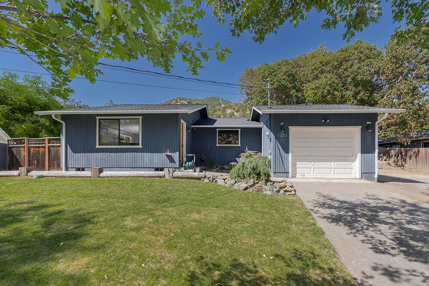 Back on the market, home and property not at fault. This immaculately maintained 2 bedroom, 1 bathroom home offering 792 sq ft of comfortable living space on a spacious .25-acre lot. Built in 1990, this property features a functional layout with great natural light and a cozy atmosphere. Recent updates include a newer roof and gutters, adding peace of mind and long-term value. The large backyard offers endless possibilities for gardening, outdoor entertaining, and even raising chickens with a charming chicken coop already in place. Conveniently located just minutes from downtown Gold Hill, local shops, restaurants, and the scenic Rogue River. Listing agent is related to the seller.