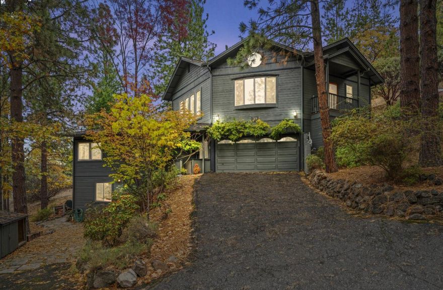 Discover a serene retreat with breathtaking views at 724 Terrace St in Ashland, OR. This 4-bedroom, 3-bath home offers 2,231 sq. ft. of thoughtfully designed living space, nestled above Ashland with stunning valley and mountain views. Highlights include a spacious, light-filled living room with vaulted ceilings, large windows, and a cozy fireplace. The open-concept kitchen boasts high-end appliances, ample counter space, and an inviting dining area. Relax on multiple decks, perfect for sunset evenings or morning coffee surrounded by nature. The primary suite features an en-suite bath and private deck access. With beautiful landscaping, a generous garage, and close proximity to Ashland's theaters, restaurants, and trails, this home combines luxury with convenience and tranquility. Don't miss this exceptional property—schedule your tour today!