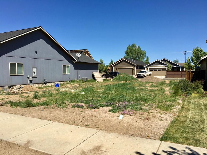Ready to build lot in desirable SW Bend. Surrounded by well cared for homes, this flat .13 acre city lot has all the utilities at the street. No Homeowner's Association or CC&R's allow you to build the home you truly want. Even add an ADU! Easy access to the parkway and vibrant downtown, close to the Old Mill district, shopping and new St. Charles medical facility.