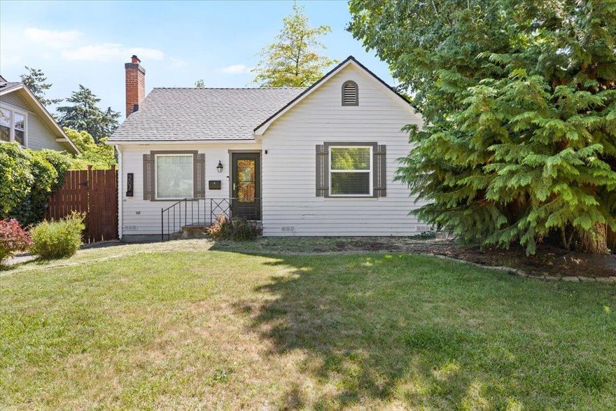 Back on Market - No Fault of Property!!  Thoughtfully remodeled East Medford home blending charm with modern upgrades! Converted from a 3 bed/1 bath to a spacious 2 bed/2 bath layout, this home features original hardwood floors, a cozy living room with a white brick fireplace, and abundant natural light. The kitchen offers cute and quaint that meets functional flow. Major updates include a new roof in 2024, brand new range hood, updated electrical, and a central AC unit installed in 2021. Both bedrooms are generously sized. Enjoy a landscaped front yard, a private fenced backyard with alley access, and a detached shop—ideal for hobbies, storage, or a home gym. Located on a quiet street in a desirable neighborhood, this move-in ready gem is a must-see!