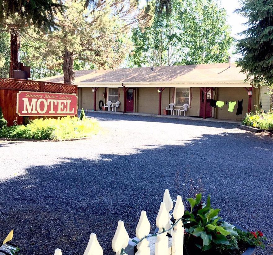 Sisters Motor Lodge is located in the heart of beautiful Sisters, Oregon. The only motel in the downtown area where you can walk to all of the restaurants, galleries, and shops in Sisters. The motel is an 11 room, charming, boutique motel that has been in business since 1938. The property consists of 5 well-maintained buildings on 0.73 acres of land. Rooms include a mix of Deluxe King and Queen rooms with kitchenettes, high speed Wi-Fi, and Cable TV. Many have private decks where guests can enjoy the amazing views of the Three Sisters and the beautiful flower gardens and water feature on the property.
Also on the property is a 1,250 SF 2 bedroom, 1 bathroom home that was remodeled in 1996. Perfect for an on-site Owner/Manager home and office area.
Cell tower land and assignment of T-Mobile cell tower lease is also for sale. The sales price for the tower is $262,000 and is only available for sale along with the purchase of the Sisters Motor Lodge.