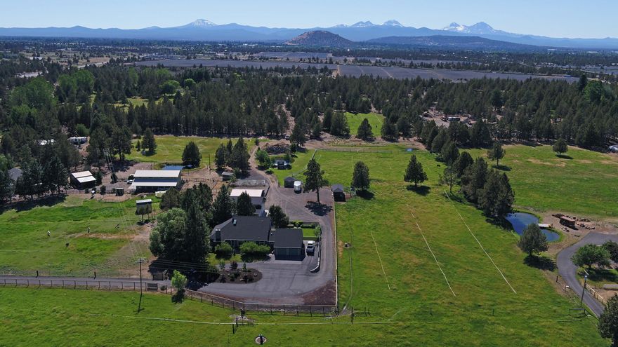 BEND PROPERTY!  Immaculate Property on10 Acres  only 2.5 Miles from Shops & the hospital.  Could be Hobby Farm or a working 
Farm. On the main level is a renovated Kitchen ,cabinets made local. large Living Room with a Pellet Stove & high Ceilings, Dinning, Laundry, Mud Room, 2 bedrooms, one full bath, half bath. The second level features a Primary Suite with Mountain Views.
Out side you'll enjoy the fenced Backyard, COID water rights, Lined  Irrigation Pond big enough to swim in, patio and raised Garden Beds. Large 40x48 insulated & heated Shop, any man's Dream. If your are renting storage space now, this would save you $. Garden Shed.3 Stall  Barn with Tack Room. Chicken coop, Hog Barn and feeding Area for your Live Stock, fenced in Garden Area Plus a Play Structure. New electric New Zealand Fencing. 8 Acres of Hand line irrigation Pipes included, easy set up, no daily pipe moving. RV dump station. lots of room outside for additional storage. Horse shoe pit, area for your Burn pil