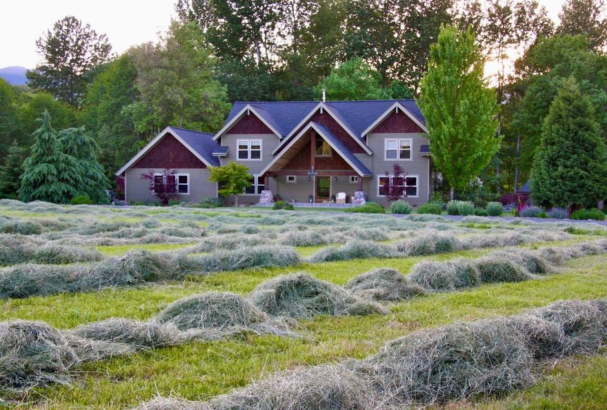 Built in 2002, this contemporary lodge style estate features a 3048sq ft open concept floor plan with spacious rooms and attractive views.  The main floor features a great room with a beautiful rock fireplace, kitchen, dining area, mud room, full bath, guest bedroom and den opening to outdoor entertaining with a built-in BBQ, and in-ground pool and spa. Upstairs living space includes a master suite with a
private balcony, spacious walk-in closet, a soaking claw tub, and large walk-in shower. All of this nestled back on a wonderful creekside with nearly 6 irrigated acres of a manicured park-like riparian setting. This property has it all: Horse barn with a 680 sq ft ADU currently occupied and producing $750 a month in rental income, with a month to month lease. This property has also been a popular wedding venue over the years and is a must see. To tour this home call Brandie 541-660-1468 All information deemed reliable and accurate.  Buyer to perform own due diligence.