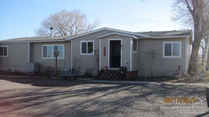 Just out of town on 4.8 irrigated acres. This well kept 1848 SF MFG home has 3 bedrooms and 2 baths. Large shop/garage plus an out building with concrete floor. Cascade mountain views. A beautiful place to call home!