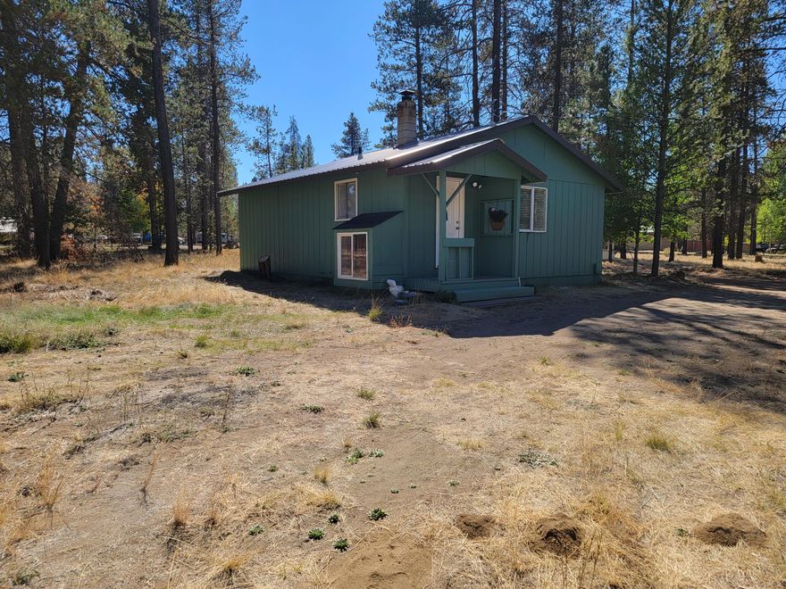 Fresh and clean this cottage includes a 440 sq ft finished basement with laundry room, could be a great bedroom, craft room or what ever your needs are. Frame built with metal roof, new flooring and paint, updated bathroom. Garage is detached and has sliding door - located in city limits of La Pine, with sewer and water planned to come in soon. Finished basement has great egress and could be converted to an additional bedroom or what ever your needs are.