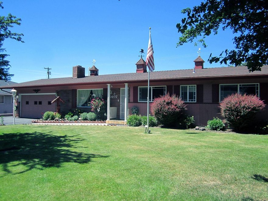 This quality built home will exceed your expectations, larger than it appears from the street. Over 2600 sq ft features formal living room with natural gas fireplace. Formal dining both with beautiful hardwood floors. Three family rooms, yes three, one with it's own kitchen. Step down from one family room with free standing fireplace into the relaxing glass porch facing backyard. Updated kitchen with solid counter tops plenty of cabinets, eating area with serving buffet open to adjoining large room with natural fireplace. Over sized master suite with relaxing sitting area, double closets and updated bath overlooks backyard. Private fenced beautifully landscaped yard with 18'x 10' therapeutic hot tub enclosure just steps from the 23'x 10' covered patio. Garden shed for lawn equipment. The 50'x 12' RV garage hides the 20x 24 shop. Roof approximately 5 years. Water heater and water softener new 2018. Security system. Show and enjoy this Perry Day built home that has been well maintained