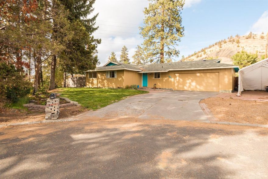 Newly remodeled midtown single level home with RV parking located at the base of Pilot Butte. This home features new flooring, paint, appliances, and complete bathroom remodels, a spacious living room, generous dining area & kitchen, new living room & master bedroom windows & dining room sliding door, newer central gas furnace, attached double garage, fenced back yard with great mature trees, a large back deck, and it's location allows you to walk or bike right from the house on Bend's great trail systems!