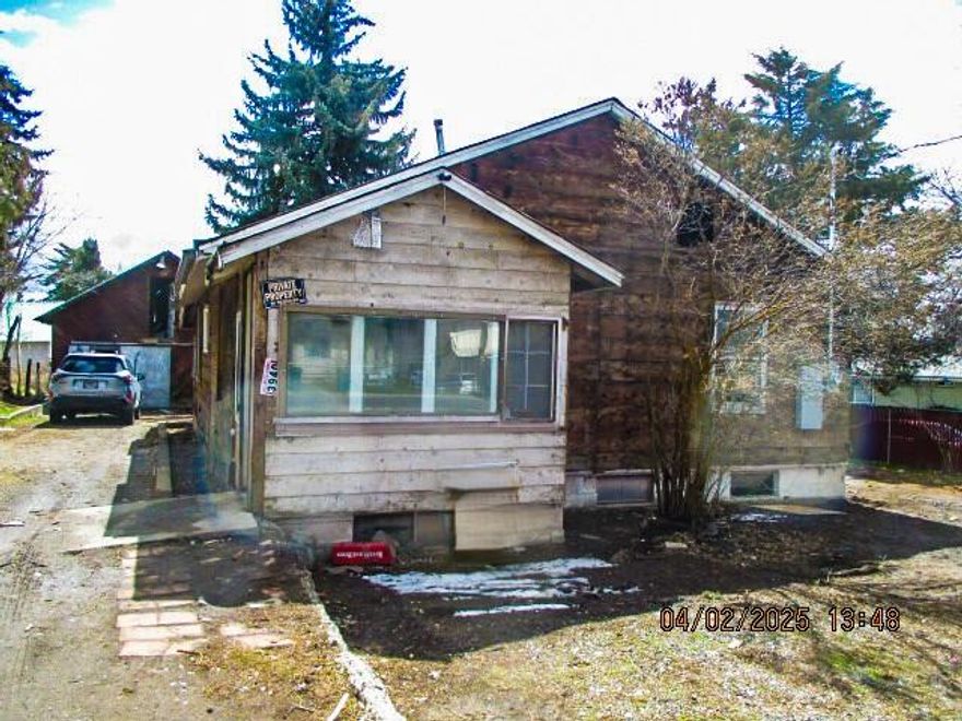 This property presents a fantastic opportunity for investors or homebuyers looking to customize their own space! With a spacious layout featuring three bedrooms and a bathroom on the main floor, there's ample room for family living. The unfinished basement adds potential for additional living space, storage, or personal projects.  The large lot size of 0.38 acres is perfect for outdoor activities or even a garden, offering plenty of possibilities for landscaping and recreation. The garage/barn, while in need of repair, could be transformed into a great workshop or storage area with a bit of investment.  With some upgrades and a touch of creativity, this home could significantly increase its value and appeal.  Property has a new electric panel.