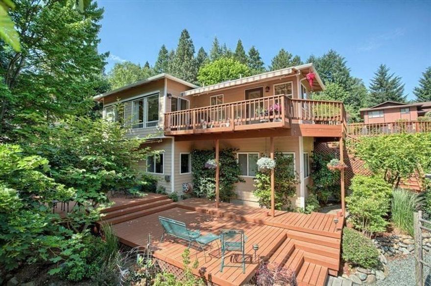 Like a private park? Then this is the house and setting you have been waiting for. Home has large windows that look out over the beautiful and well maintained open space that is part of what makes this Roca Canyon Estate home special. Large decks on both the upper and lower levels, with retractable awnings help one take advantage of the outside living we enjoy in Southern Oregon. Inside is a comfortable home that is on the market for the first time. Formal dining room, living room with large windows and a gas fireplace, kitchen with tile counters and a breakfast nook. A large master bedroom is on the main level for single level living on the same level as the two car garage. Downstairs features a family room with a wet bar and access to a large deck, creek and fenced in raised bed garden. There are 2 additional bedrooms plus a den that could be used for a small 4th bedroom if needed. Seller will provide a home warranty.