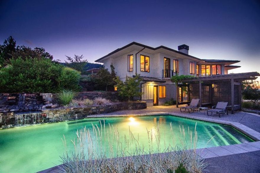 Quintessentially Ashland! First time on the market, custom home with fabulous Pacific Northwest Styling and Arts & Crafts touches. Ideal location on a private knoll with 8.41 acres, expansive views of Grizzly Peak and Rogue Valleyjust minutes to downtown. Award-winning construction by Eric Laursen, coffered ceilings, Brazilian cherry floors, fir doors and trim, expansive walls of wood clad windows, art glass lighting, gas fireplace, built-in bookshelves, separate den, top notch details throughout. Gourmet kitchen with eating island, 5-burner Wolf cooktop, double oven, cherry cabinetry, custom countersall adjacent to the dining area and expansive outdoor deck for soaking in the outdoors. Luxurious master bedroom suite on the main floor with balcony, custom tile, infrared sauna, double head shower, and sunken tub framed by a window of views. Two separate bedrooms downstairs with private bath, adjacent to the resort quality lagoon pool with waterfall feature.