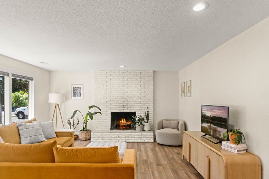 Authentic mid-century style melds with meticulously curated finishes to create this single level ranch style home in one of Bend's hottest neighborhoods. Located on an oversized private lot in the heart of Midtown, this beautifully updated home includes all the must-haves on your list. Anchored by a wood burning fireplace, the main living space has large picture windows for abundant natural light, while the fully renovated kitchen includes new appliances, quartz countertops, new fixtures & updated cabinetry. Easy access to a large back deck makes this home perfect for entertaining & outdoor dining. An inviting primary suite opens to the hot tub & the back deck and features a recently updated bath with tile shower, dual vanity & new fixtures. The fully fenced backyard is green-thumb ready with room for gardening & gatherings with mature trees, expansive lawn & fire pit. Comes with architectural plans for an addition that would be on the front of the home. Property is zoned for an ADU.