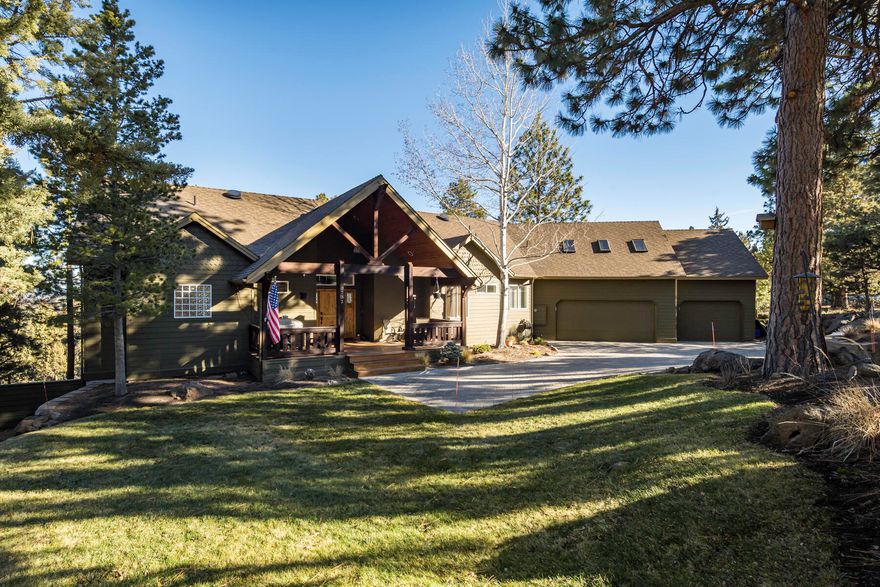 Enjoy privacy and views from this gorgeous home on a large lot in popular NW Bend! The huge windows in the vaulted great room let the light in, the gourmet kitchen features an extra large granite center island and Viking appliances and separate pantry area are perfect for entertaining and cooking your favorite meals. Watch the beautiful Deschutes River flow while you are at the kitchen sink. The 2529 SF home offers single level living with the primary suite, a second bedroom or office, along with a second full bathroom and a large utility room on the main floor. Upstairs is a third bedroom, full bathroom and living space, perfect for guests or bonus space. The extensive decking off the great room provides lots of outdoor living options while enjoying the quiet nature sounds, views of the river and trees. The large covered front porch offers more space for enjoying the outdoors. The three car heated garage has plenty of room to store your toys. All this and more, come see it today!