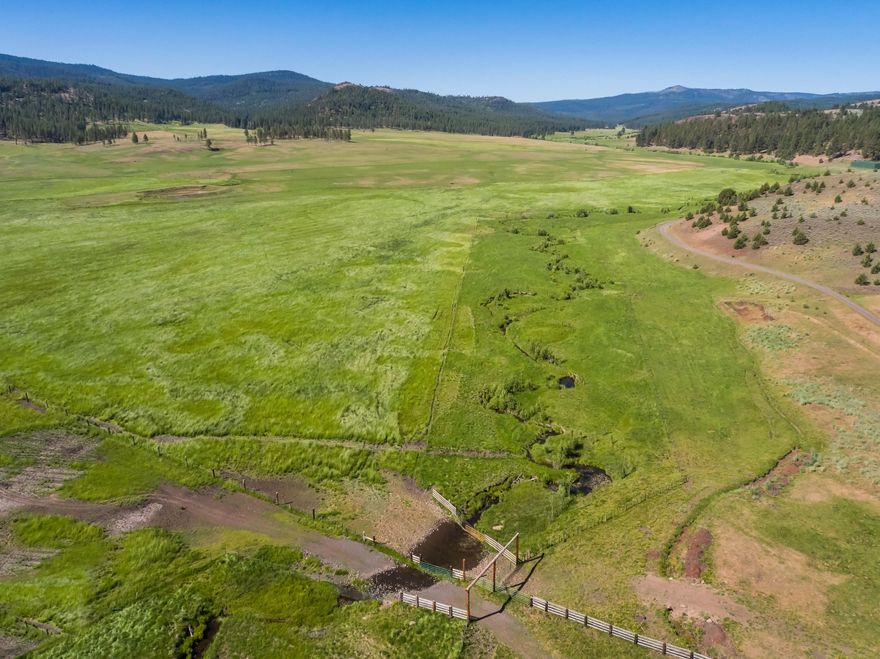 Badger Creek Ranch in the heart of the Ochoco Mountains is an opportunity to own a combination of recreational and working
ranch. The ranch encompasses meadows with creeks and stocked ponds, timber forest, varied topography and range land bordering
the the Ochoco National Forest. The ranch is 4021+/- acres with 825 +/- acres of water rights from Badger Creek, Thorn Hollow
Creek, Indian Creek and Mountain Creek. Improvements include a 1500 sq ft Log Cabin, Bunkhouse, Shop, livestock working facility and equipment shed. Abundant wildlife call the ranch home including elk, mule deer, turkeys, property and qualifies for LOP tags. Recreational opportunities include hunting, fishing, hiking, biking and ranching. Badger Creek Ranch is located about an 1.5 hours
from Prineville, OR.