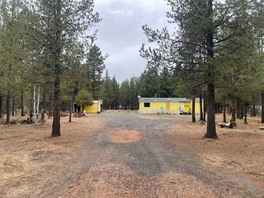 Value is in the land. Manu home in very poor condition. Level 1.03 acre treed lot features a private fenced setting, standard septic, private well.
